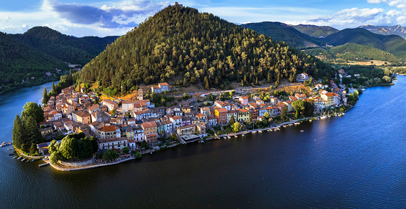 Most beautiful scenic Italian lakes - small picturesque lake Piediluco with colorful houses in Umbria, Terni province. Aerial panoramic view