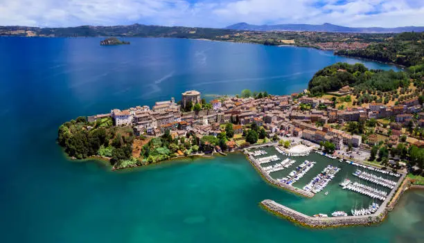 Photo of Scenic lakes of Italy - beautiful Bolsena. aerial view of Capodimonte medieval village. Viterbo province, Lazio region