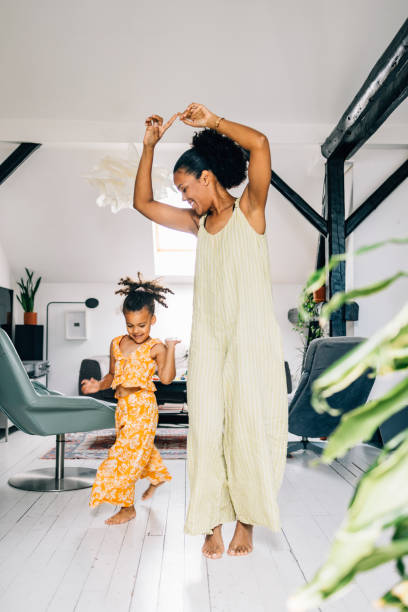 istock Mother And Daughter Dancing 1409356156