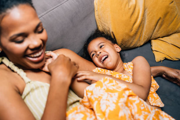 istock Mother And Daughter On The Sofa 1409356160