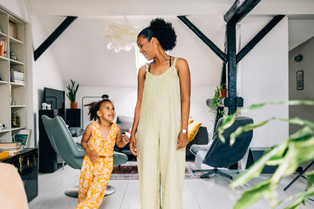 istock Mother And Daughter Looking At Each Other 1409356161
