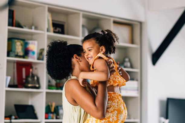 istock Mother Lifting Her Daughter In Her Arms 1409356175