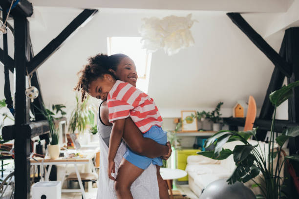 istock Mother Holding Her Daughter In Her Arms 1409356221