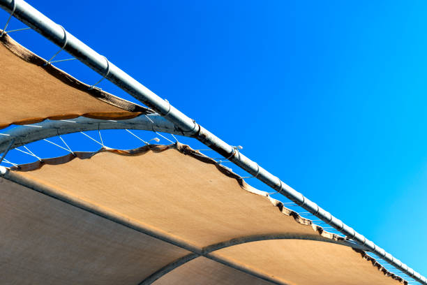 outdoor tensile cover material, against the sky stock photo