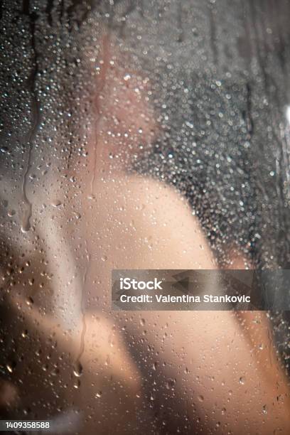 Abstract Photo Of A Man Enjoying A Warm Shower Stock Photo - Download Image Now - 25-29 Years, Adult, Adults Only