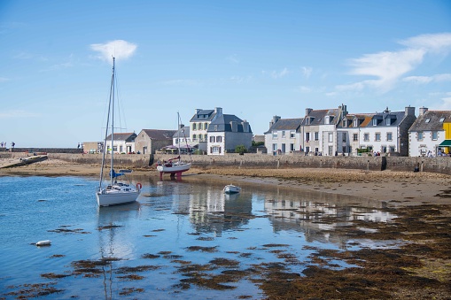 Erquy, France, June 24, 2022 - Ships and sailboats in the port of Erquy at low tide