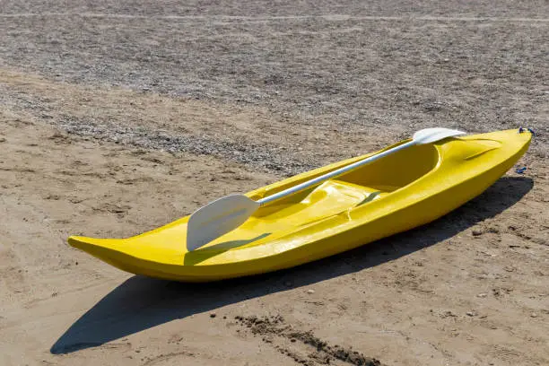 yellow single-person canoe, holiday fun toy.