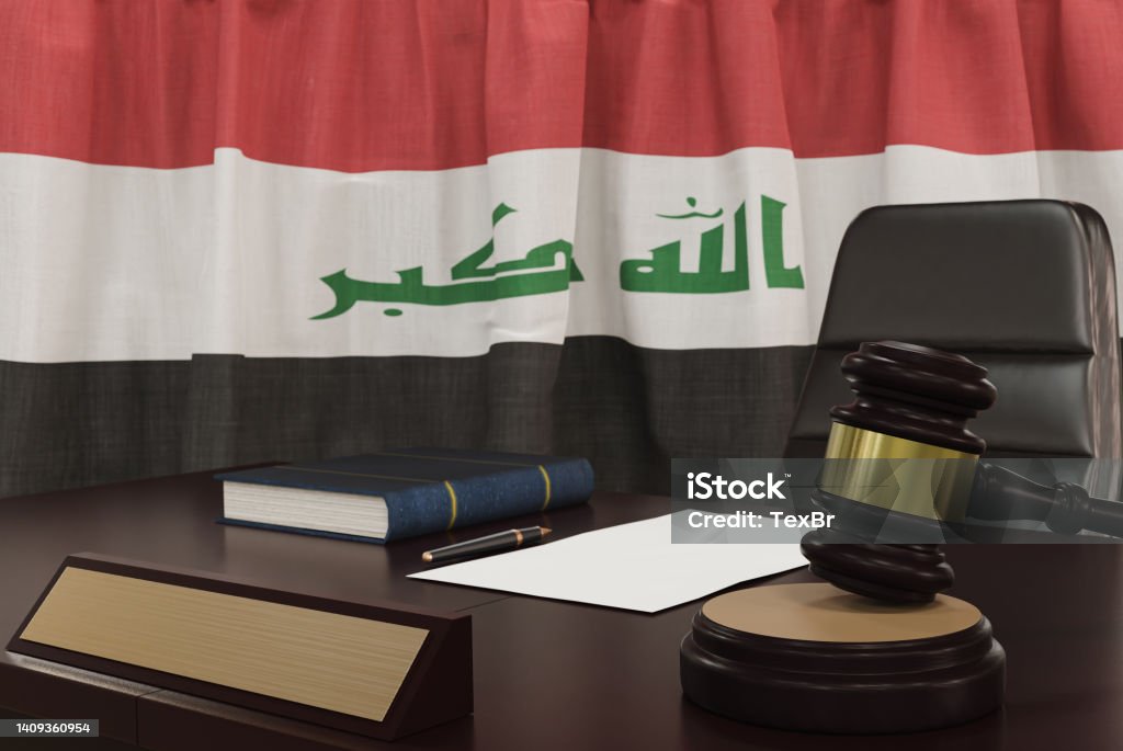 Law and justice concept,  gavel on a wooden desktop and the Iraq flag on background. 3d render. Iraq Stock Photo