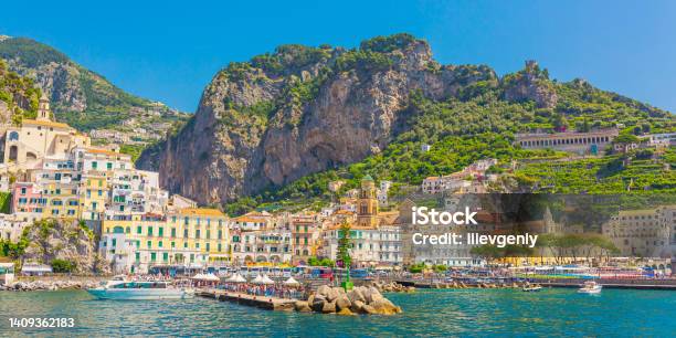 Amalfi Coast In Italy On Bright Sunny Day Beautiful Blue Expanse Of Tyrrhenian Sea Ancient City Beach Mountains Houses On Cliff Summer Trip Italian Architecture Voyage Travel Destination Stock Photo - Download Image Now