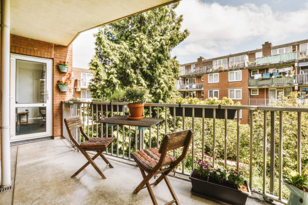 istock Narrow balcony with chairs and door 1409362235