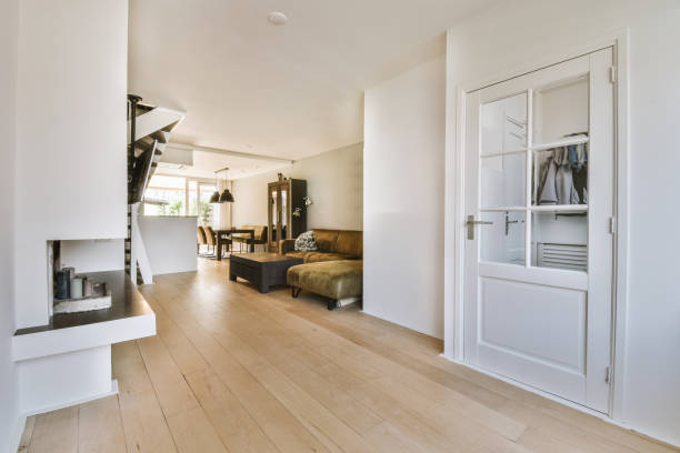istock Interior of spacious living room with staircase 1409365068