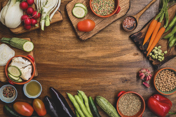 istock Various seasonal vegetables on a wooden table. vegetables frame with space for text. Healthy Organic Vegetables on a Wooden Background 1409367553