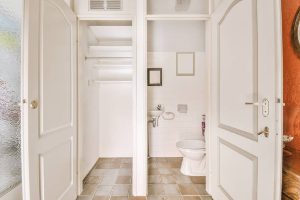 istock Simple toilet with small sink 1409368569
