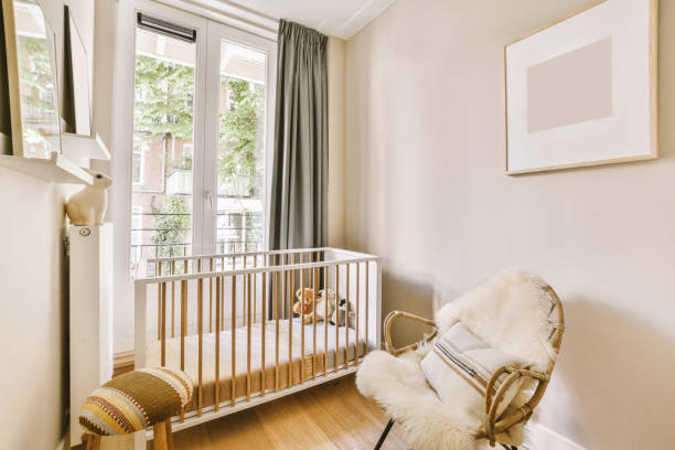 istock Light cozy baby room with cot 1409370285