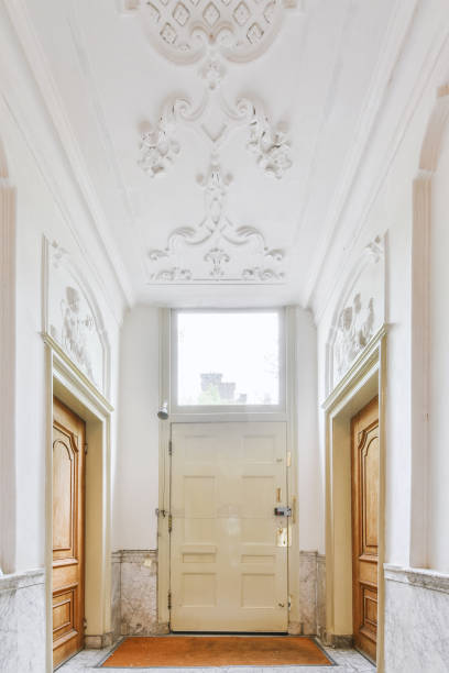 istock Spacious hall with ornament on ceiling in modern apartment 1409373658