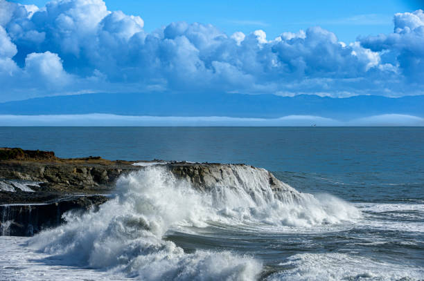 istock Turbulent Ocean Waves Crashing on Rocky Shore 1409374028