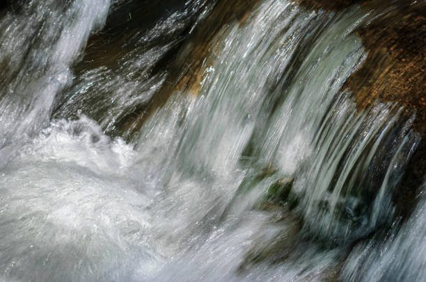 Blurred motion image of remote mountain creek cascading over rocks.Taken in Northern California, USA