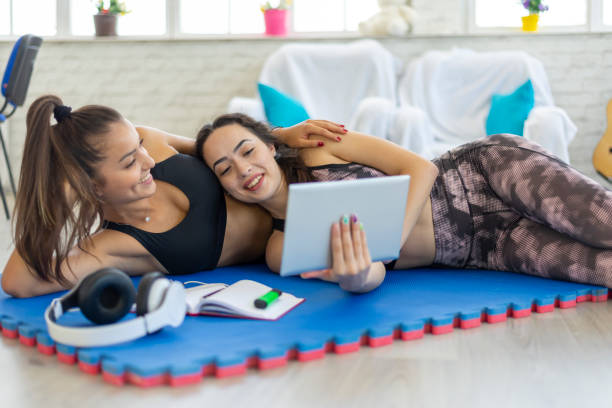 istock Female couple doing exercise at home 1409374920