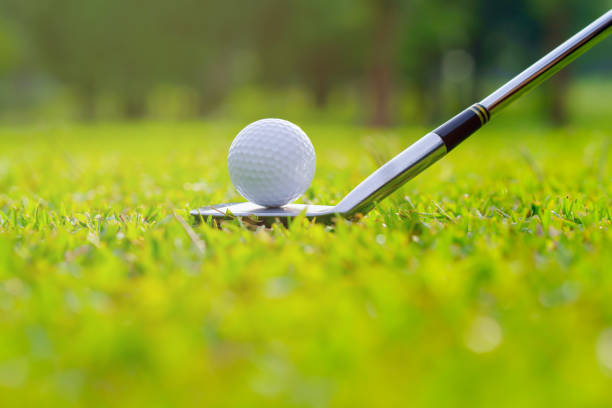 istock Golf ball on green grass ready to be struck on golf course 1409375697