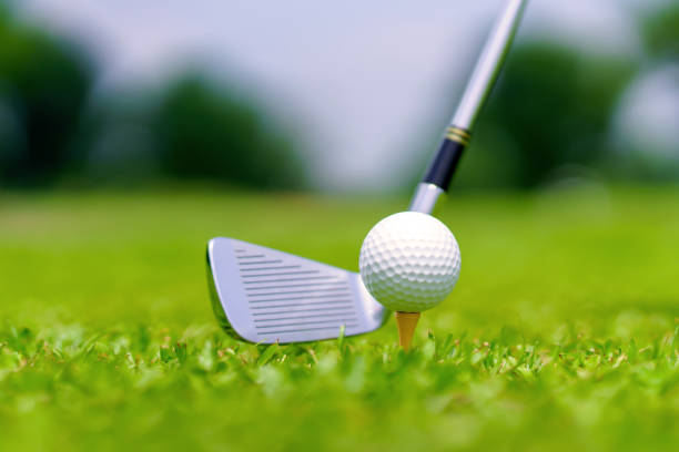 istock Golf ball on green grass ready to be struck on golf course 1409375703