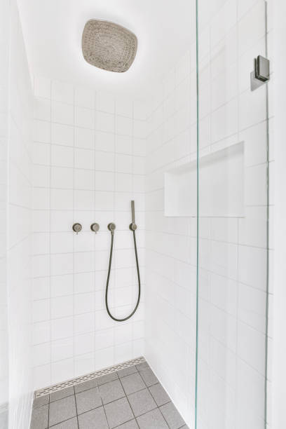 istock Shower tap with partition in tiled bathroom 1409376081