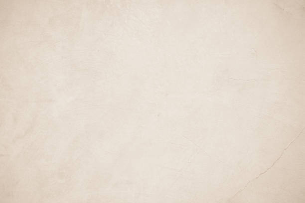 istock Old concrete wall texture background. Close up retro plain beige color cement material surface rough for show or advertise promote product content on display and brown paper design element concept. 1409376751
