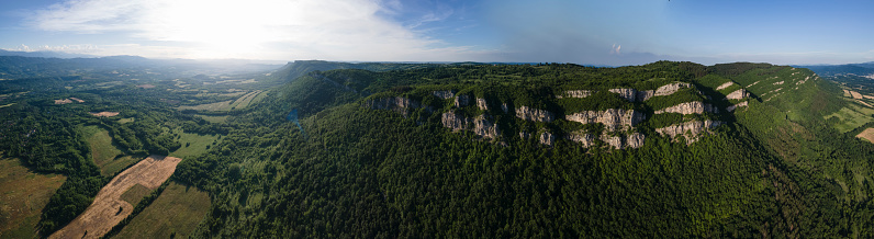 Balkan mountain forests and cliffs at sunset. Reforestation and sustainability.