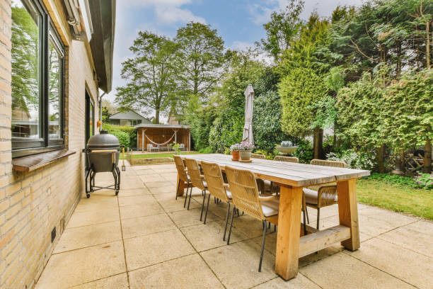 istock Spacious backyard with a seating area and a small lawn 1409377109