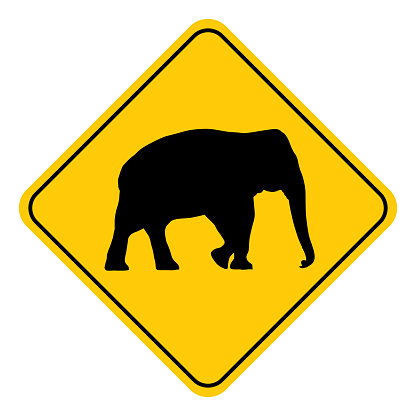 Vector illustration of a black and gold colored elephant road sign.