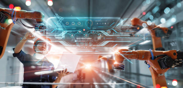 istock Engineer use laptop of checking. Install software and maintenance a robotics automatic arms on modern interface in industrial intelligent factory. Digital manufacturing operation. Industry 4.0. 1409388649