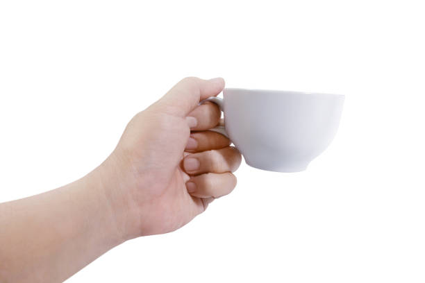istock Hand holding a white coffee cup on a white background 1409392121
