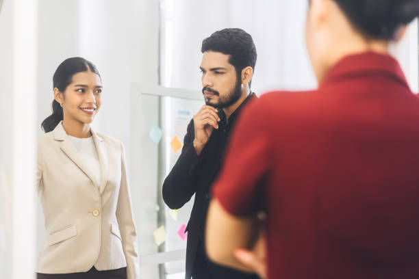 istock Business man with beard ceo look presentation and brief strategy with team in boardroom 1409393802