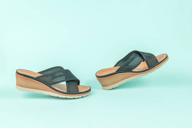 istock Walking women's sandals on a light blue background. 1409394566