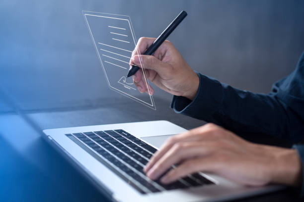 istock Businessman work from home handling documents E-signing, signing digital contracts electronic signing electronic signature through internet technology document data management smart contract agreement 1409396458