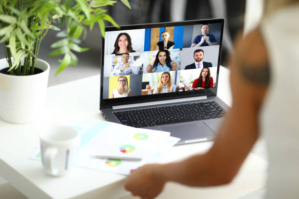 istock Woman talking with international colleagues using online video chat service 1409396669