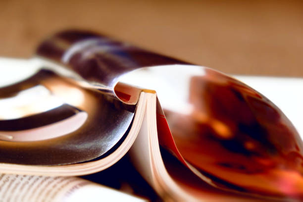 Blurred abstract background  of stacked opened magazines.