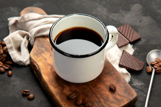 istock Cup of black coffee on dark background. 1409398827