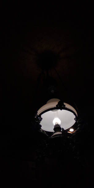 istock Hanging LED lights with Indonesian carvings 1409401712