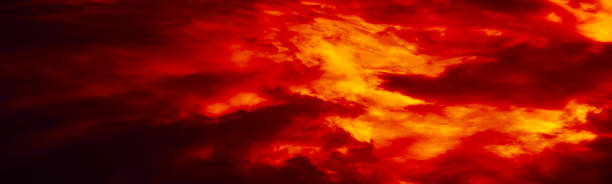 istock Black red orange sky with clouds. Fire and smoke effect. Night. Dramatic skies background with space for design. Web banner. 1409404650