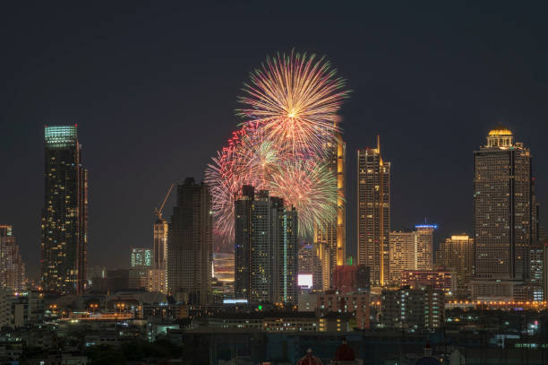 Night scene with fireworks and urban cityscape stock photo