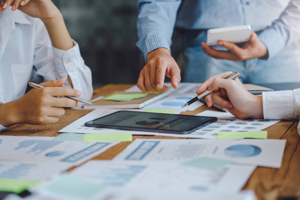 istock Business people meeting working with talk, consult, discuss working with new startup project idea presentation analyze plan marketing and investment in the office. 1409407164