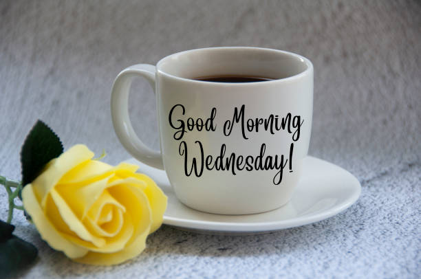 Good morning Monday text on coffee cup yellow flower on blurred marble background. Good morning Monday text on coffee cup yellow flower on blurred marble background. Morning wishes wednesday morning stock pictures, royalty-free photos & images