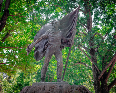 Bear Flag Monument (aka Raising of the Bear Flag), a public artwork located at the Sonoma Plaza in Sonoma, CA, in the US. The bronze sculpture is the work of John A. MacQuarrie, in 1914.