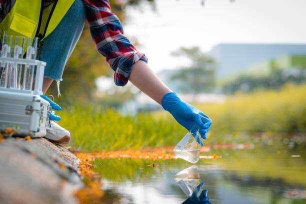 istock Hands of scientists collecting water samples for analysis and research on water quality. 1409412657