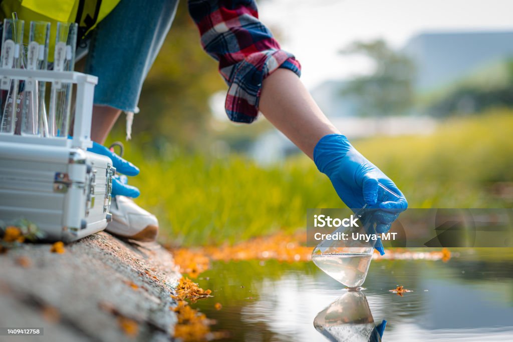 Hands of scientists collecting water samples for analysis and research on water quality. Laboratory Stock Photo