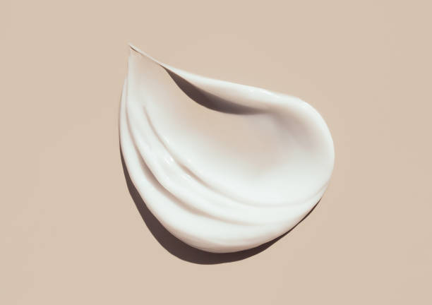 cosmetic smears cream texture on pastel background - 潤手霜 個照片及圖片檔