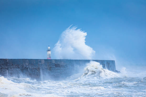 istock Newhaven Lighthouse Stormy Seas 1409418626