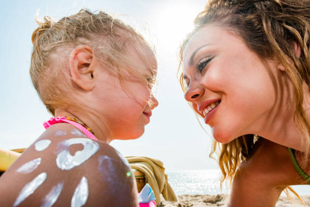 istock Mommy will put you some suntan lotion! 1409419046