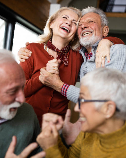 istock Cheerful mature couples having fun at home. 1409420197