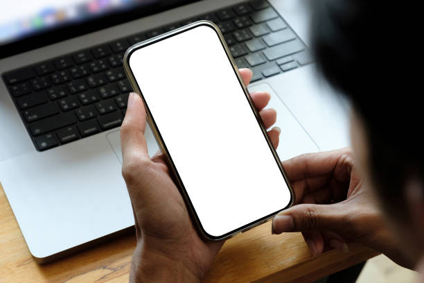 istock Mock up phone in woman hand showing white screen 1409420278